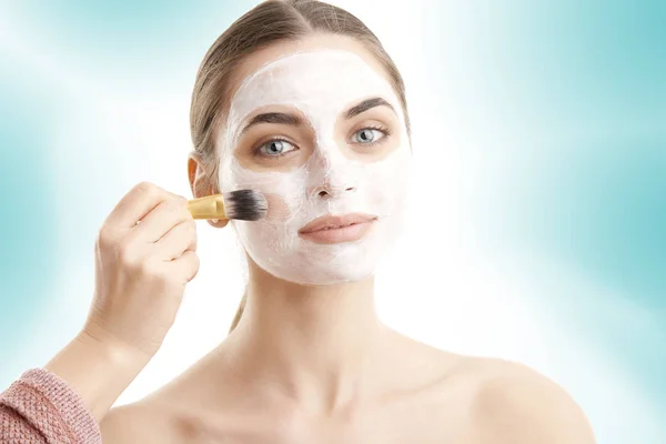 Cropped Shot Young Woman Mask Applied Her Face Makeup Brush — Stock Photo, Image