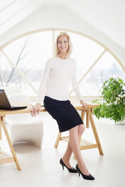 Full Length Shot Beautiful Businesswoman Toothy Smile Standing Office Desk — Stock Photo, Image