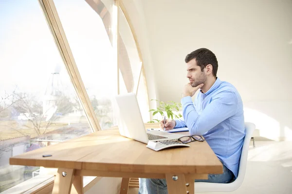 Portrait Young Businessman Hand His Chin Sitting Front Laptop Doing — Stock Photo, Image