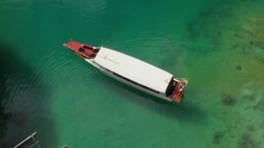 Travelling by boat through the tropical Philippine Islands overhead view