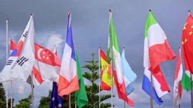 Multi national flags blowing in the wind 