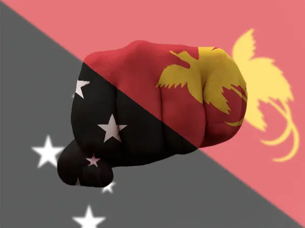 Papa New Guinea Flag painted on human fist representing power — Stock Photo, Image