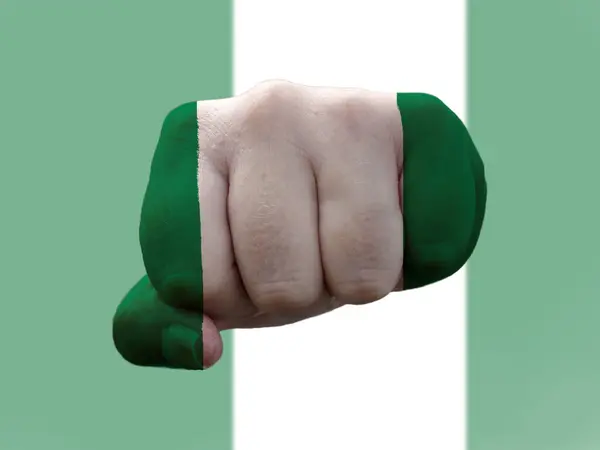 Nigeria Flag painted on human fist representing power — Stock Photo, Image