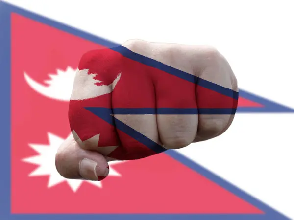 Nepal Bandeira pintada em punho humano representando o poder — Fotografia de Stock