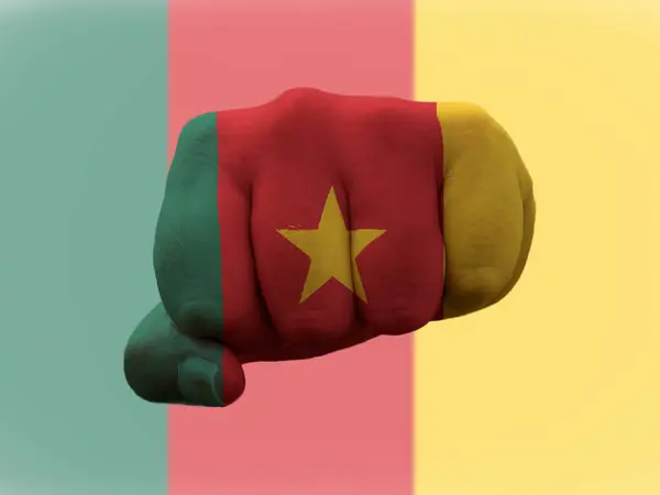 Cameroon Flag painted on human fist representing power — Stock Photo, Image