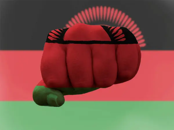 Malawi Flag painted on human fist representing power — Stock Photo, Image