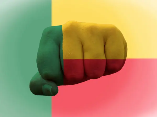 Benin Flag painted on human fist representing power — Stock Photo, Image