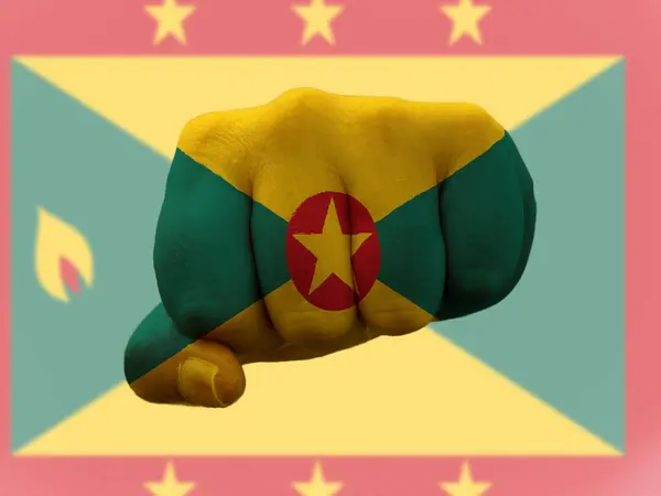 Grenada-Flagge auf menschliche Faust gemalt, die Macht symbolisiert — Stockfoto