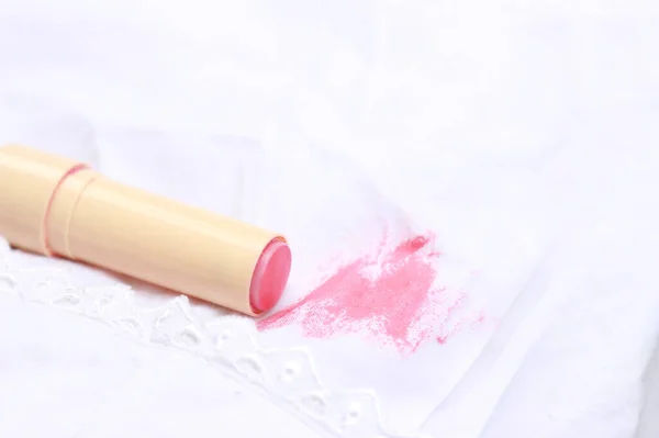 Dirty lipstick stain on fabric for cleaning concept