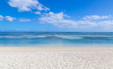 public beach of Flic en Flac Mauritius overlooking the sea clipart