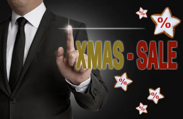 XMAS Sale touchscreen is operated by businessman — Stock Photo, Image