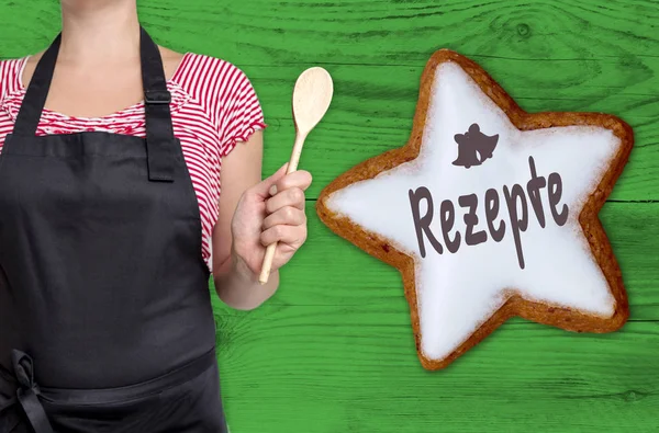 Rezepte (en recetas alemanas) Estrella de la canela se muestra por el chef —  Fotos de Stock