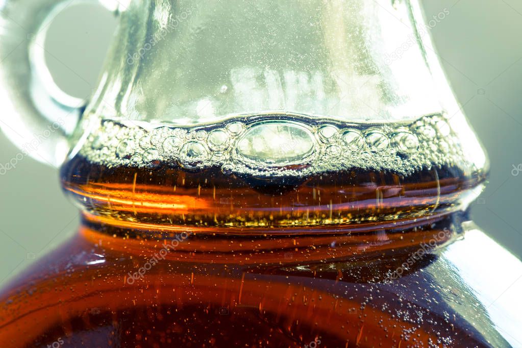 Maple syrup in a bottle in detail