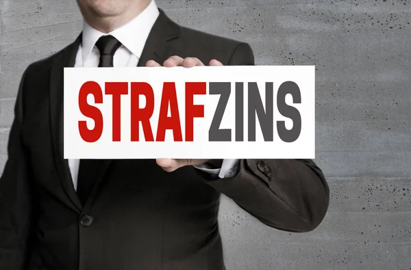 Strafzinz (in german negative interest) sign is held by business — Stock Photo, Image