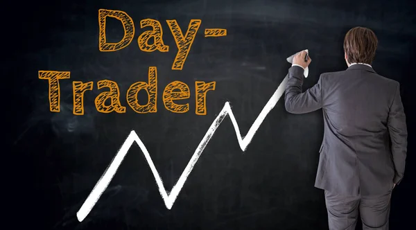 Businessman writes daytrader on blackboard concept — Stock Photo, Image