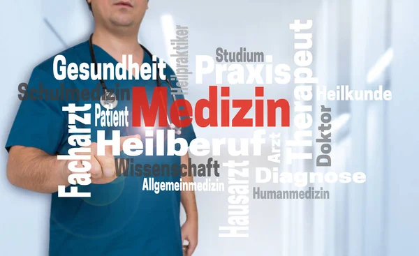 Doctor shows on viewer with Medizin (in german) medicine wordclo — Stock Photo, Image