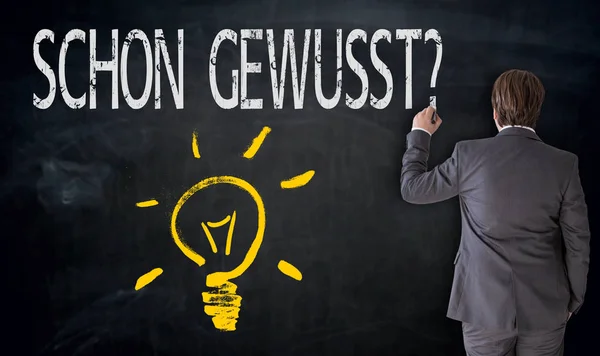 Üzletember festészet izzó és schon gewusst? (a német — Stock Fotó