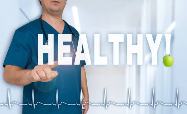 Healthy doctor shows on viewer with heart rate concept — Stock Photo, Image