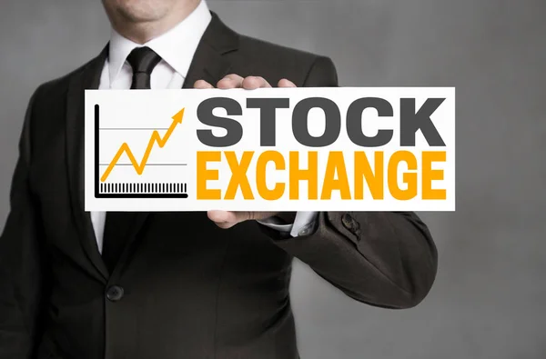 Beurs teken wordt gehouden door zakenman — Stockfoto
