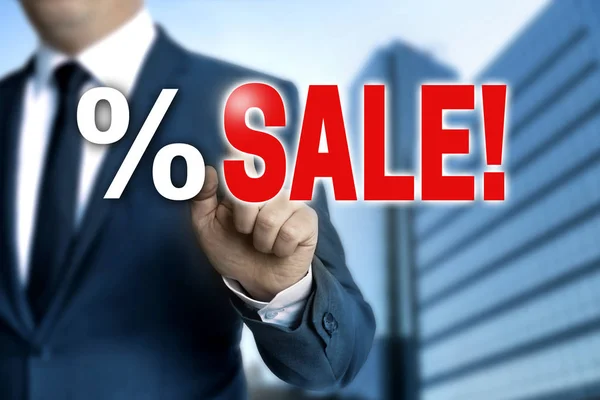 SALE touchscreen is operated by businessman — Stock Photo, Image