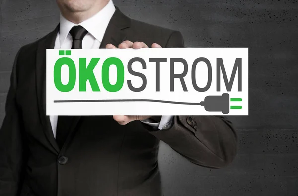 Oekostrom (in german Green electricity) sign is held by business — Stock Photo, Image