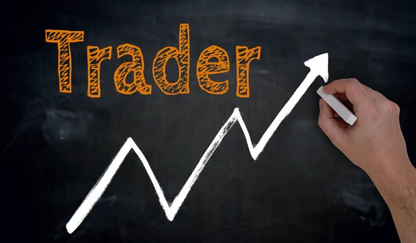 Trader é escrito à mão no quadro negro — Fotografia de Stock
