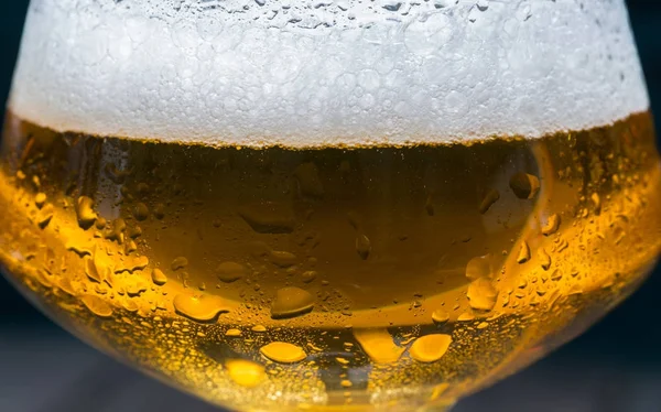 Craft beer with foam in a glass macro shot — Stock Photo, Image
