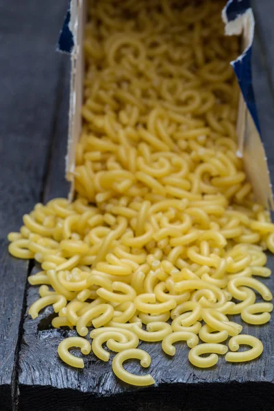 Gobbetti noodles on dark rustic wood — Stock Photo, Image