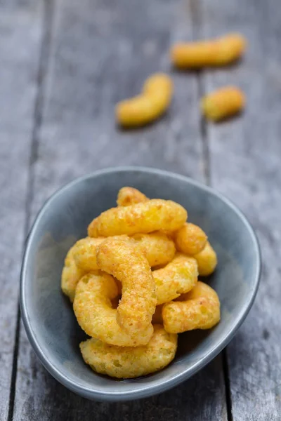 Peanut chips on gray rustic wood — Stock Photo, Image