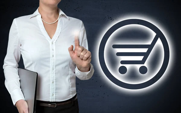 Shopping cart ikonen pekskärm visas av affärskvinna — Stockfoto