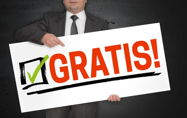 Gratis (på tyska gratis) affisch hålls av affärsman — Stockfoto