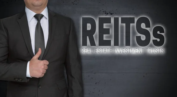 Reits concetto e uomo d'affari con i pollici in su — Foto Stock