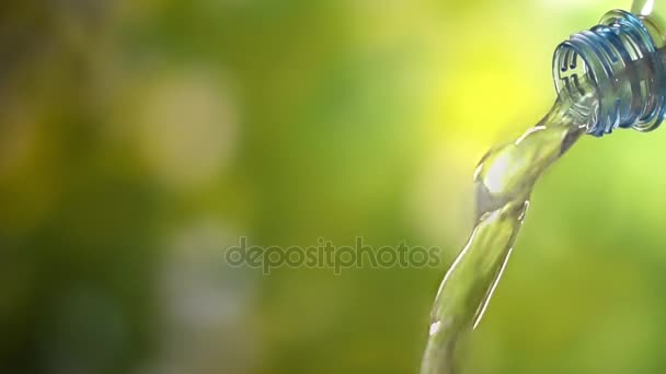 Super slow motion cool water pouring from a PET bottle. — Stock Video