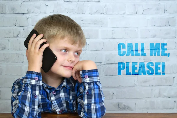 Cute little boy calling by smartphone — Stock Photo, Image