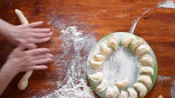 Elderly woman make dough for russian dumpling, top view, hd video — Stock Video