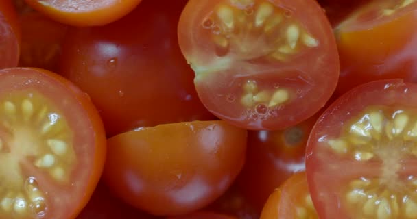 Fresh ripe sliced cherry tomatoes in bunch preparing for cooking — Stock Video