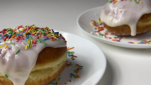 Glazed round bakery with colorful pastry toppings — Stock Video