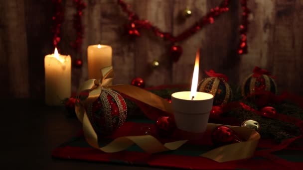 Mood Christmas Three Lit Candles One Big Flame Foreground Red — Stockvideo