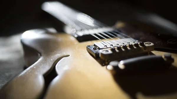 Vintage archtop guitar in natural maple close-up back light high angle view — Stock Photo, Image