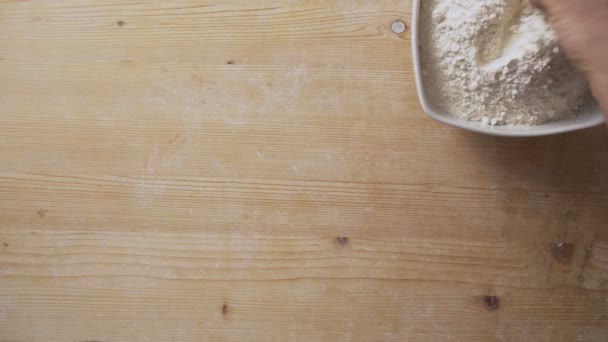 Top View Slow Motion Man Hands Sprinkling Flour Light Wooden — стоковое видео