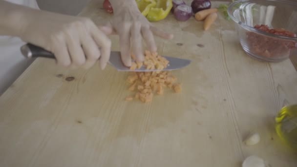 Graded Low Angle View Young Female Cook Cutting Carrots Put — Stock video