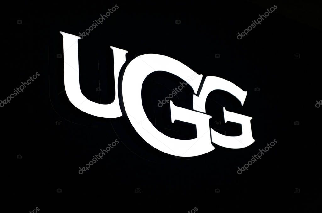 Brisbane, Queensland, Australia - 11th December 2019 : View of an illuminated UGG sign hanging in front of the store in Queenstreet mall in Brisbane.UGG is an American footwear company