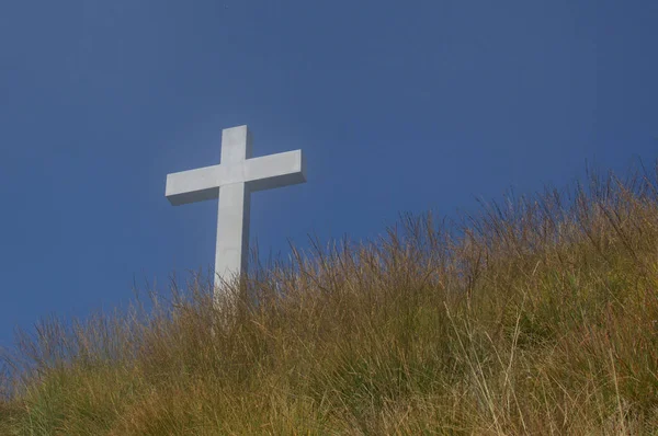 Religious cross against blue sky