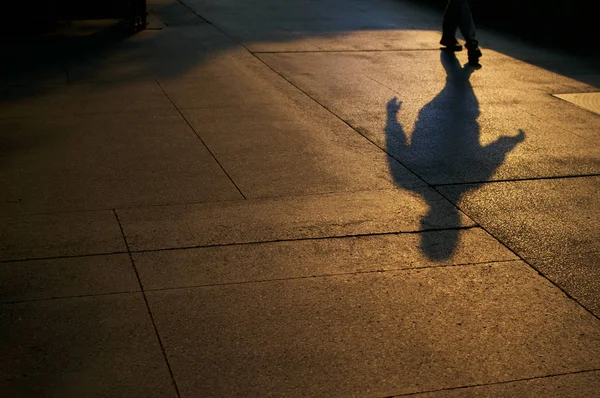 Shadows of walking man — Stock Photo, Image