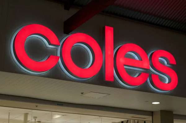 Illuminated Coles sign — Stock Photo, Image