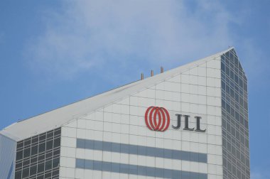 Brisbane, Queensland, Australia - 26th January 2020 : JLL (Jones Lang LaSalle Incorporated) logo hanging on the top of the building in Brisbane. JLL is an American commercial real estate services firm