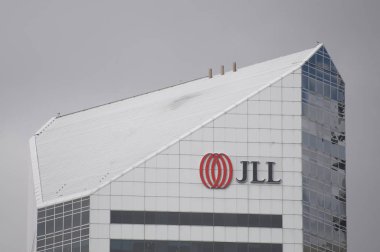 Brisbane, Queensland, Australia - 26th January 2020 : JLL (Jones Lang LaSalle Incorporated) logo hanging on the top of the building in Brisbane. JLL is an American commercial real estate services firm clipart