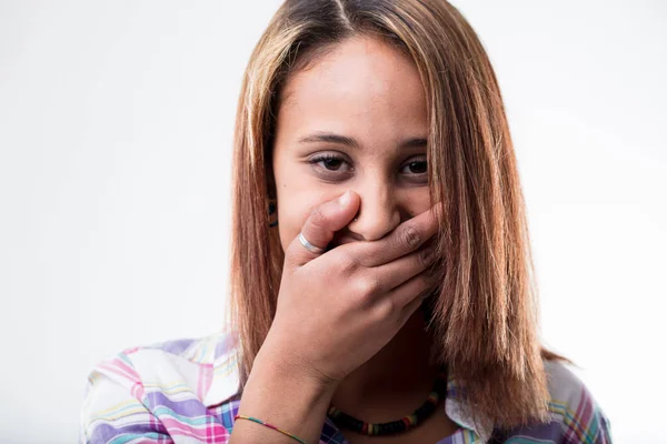 Embarrassed young woman covering her mouth — Stock Photo, Image