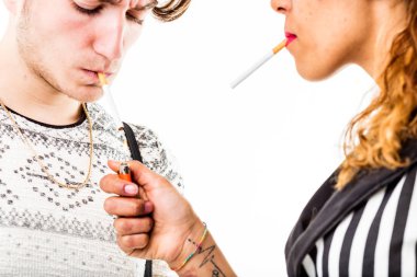 woman lightin a cigarette to a man clipart
