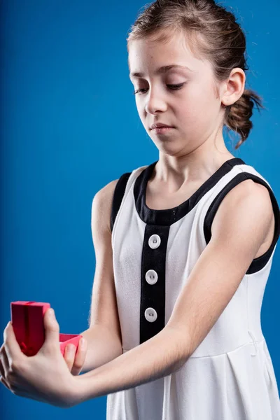 Girl receiving no doubt the wrong gift — Stock Photo, Image